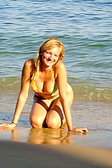 Topless bikini girl in the sea